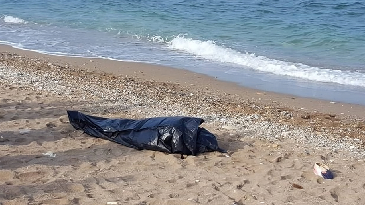The sea waves carry the bodies of two young men around Tetouan
